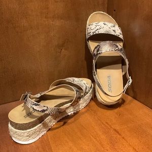 Soda size 9 faux leather with woven platform heel.